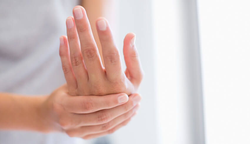 a woman scratching her hands