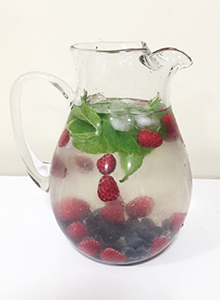 A pitcher of Blueberry & Green Tea Infusion