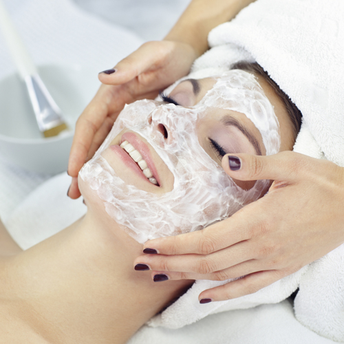 A woman getting a facial treatment