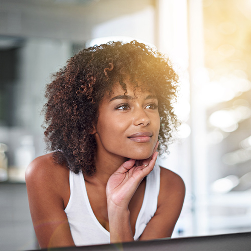 woman looking in mirror