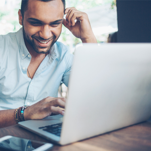 A man looking at a laptop