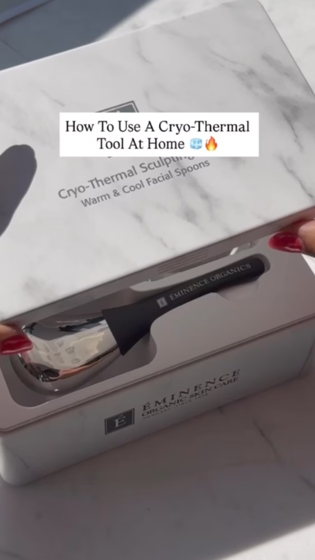 Eminence Organics Cryo-Thermal Sculpting Tool A woman opening the Eminence Organics Cryo-Thermal Sculpting Tool box