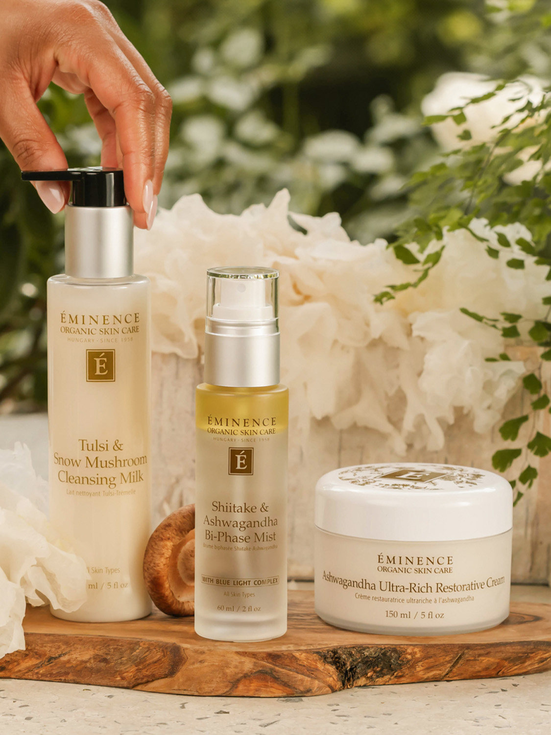 Eminence Organics Tulsi & Snow Mushroom Cleansing Milk A woman reaching for the Eminence Organics Tulsi & Snow Mushroom Cleansing Milk